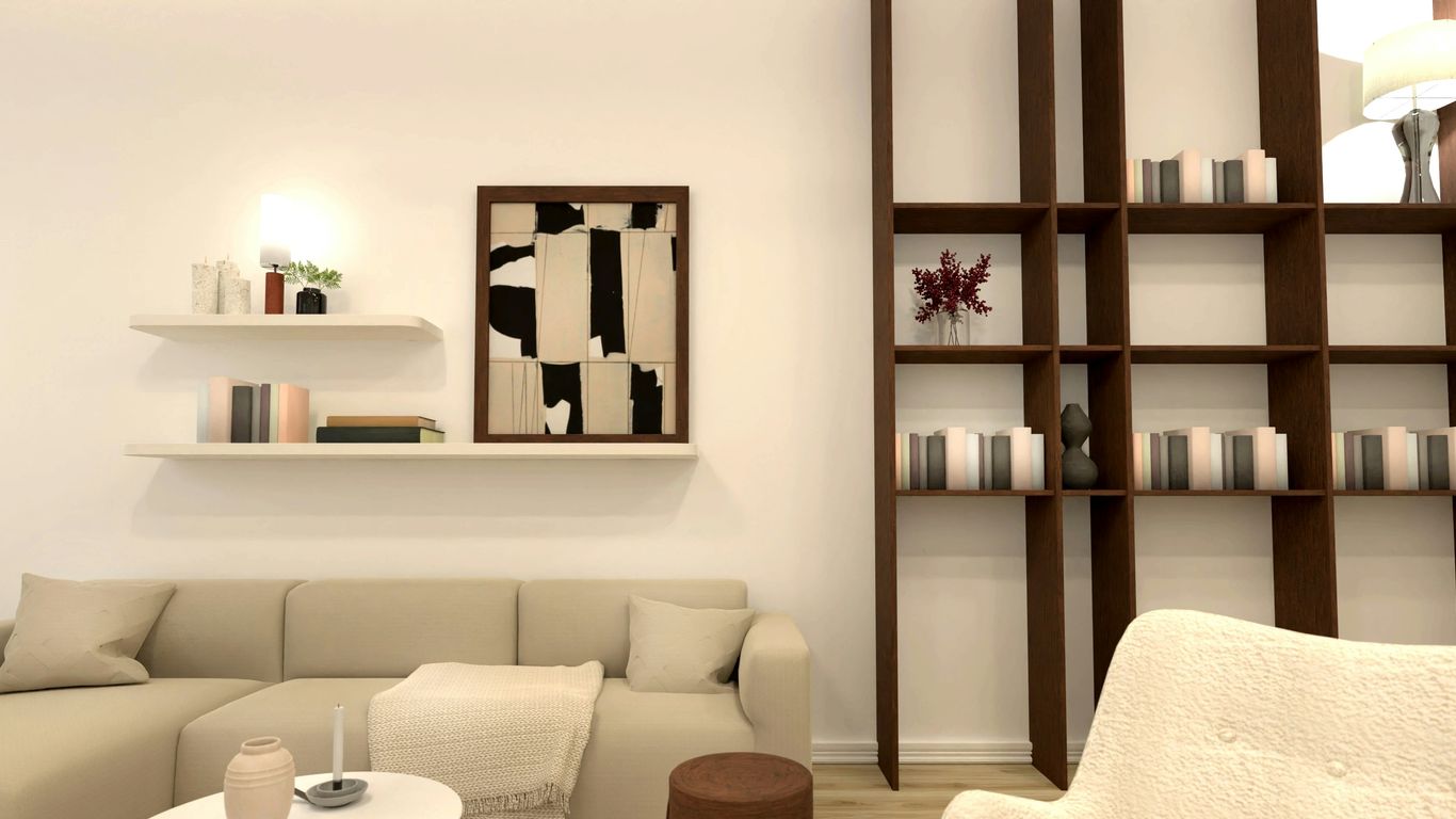 Modern living room with sectional sofa and bookshelf.